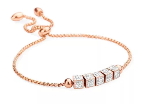 Bracelet rectangulaire en or rose avec pierres blanches