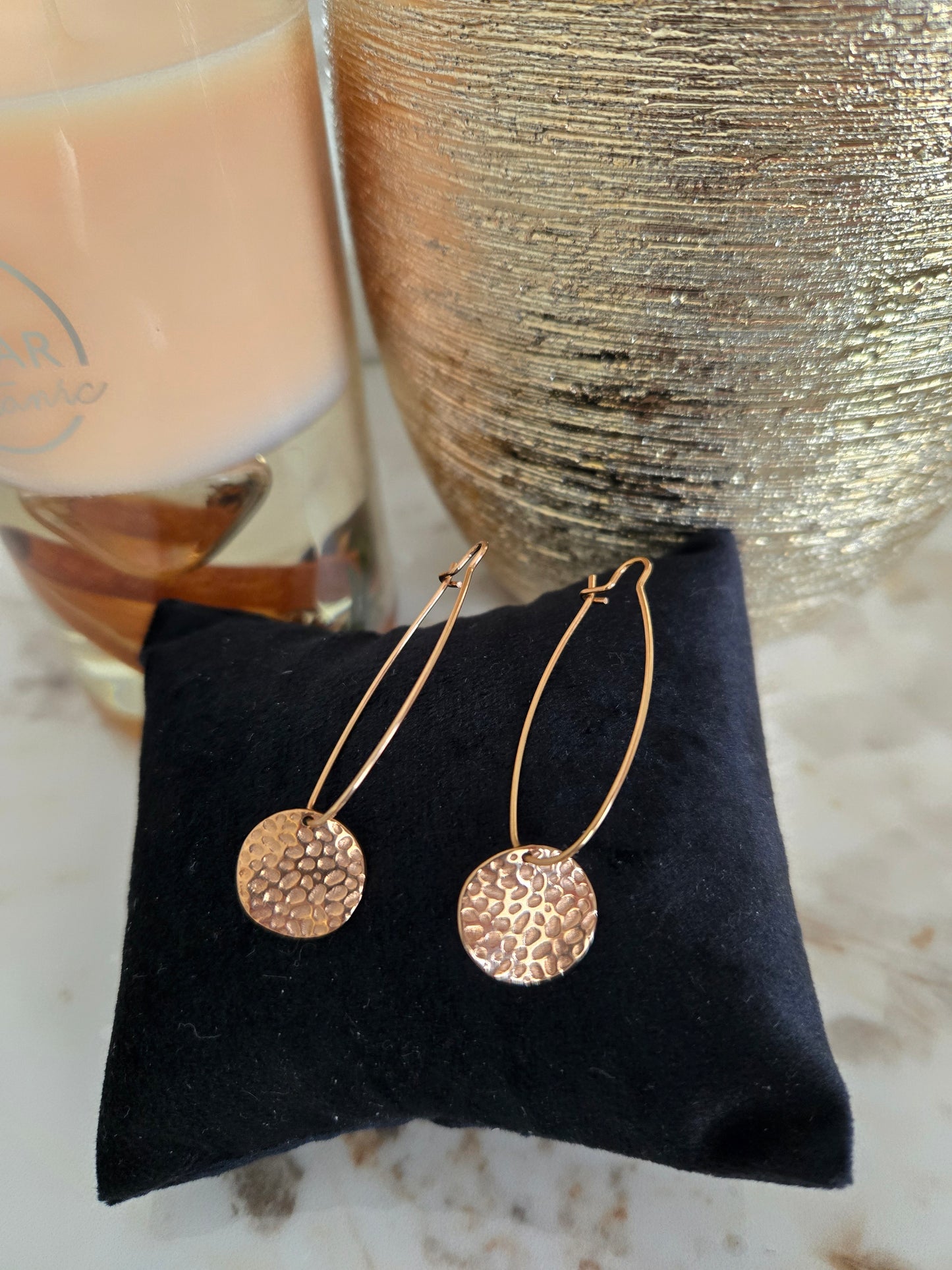 Boucle d'oreille couleur or rose