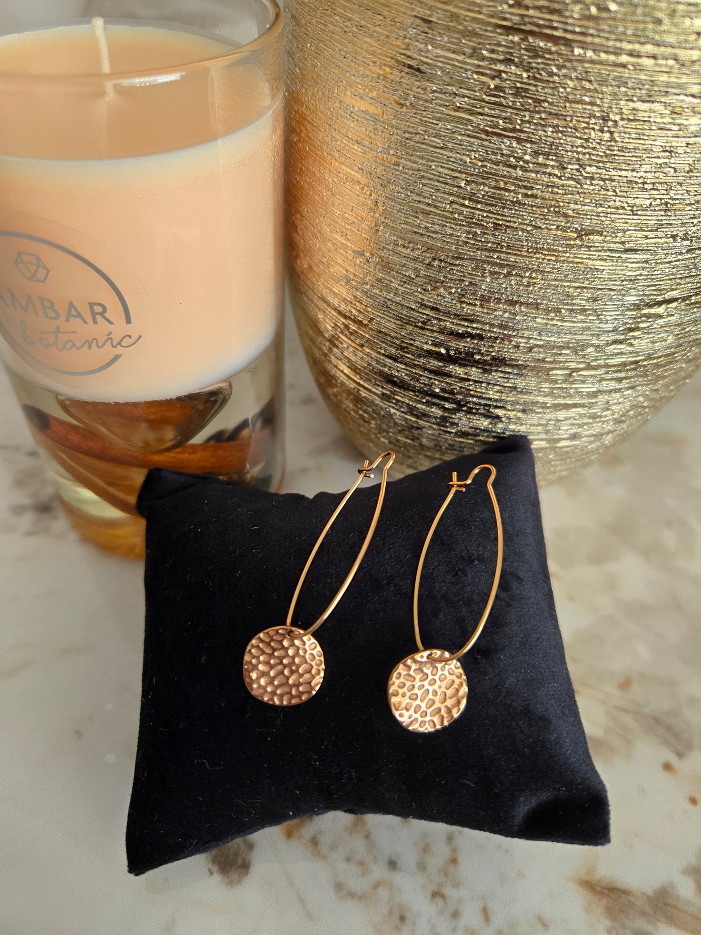 Boucle d'oreille couleur or rose