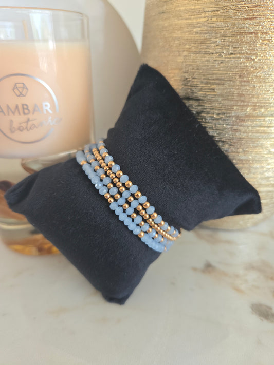Bracelet en perles bleues couleur or rose
